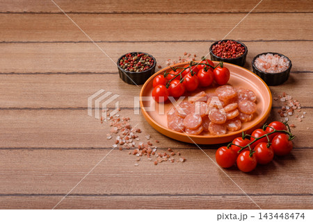 Sliced dry cured chicken sausage or smoked meat with salt and spices. Sliced smoked chicken sausage Sliced dry cured chicken sausage or smoked meat with salt and spices. Sliced smoked chicken sausage 143448474