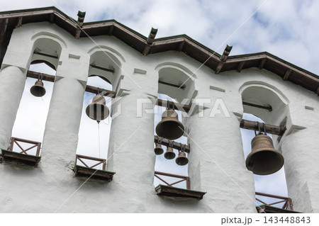 Bronze church bells in the belfry of Pskovo-Pechersky Dormition Monastery, Russia 143448843