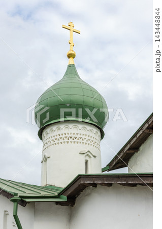 Green onion dome with golden cross on top of Church of the Epiphany of Zapskovye Green onion dome with golden cross on top of Church of the Epiphany of Zapskovye 143448844