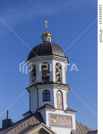 Minsk, Belarus - October 5, 2026: Pokrovsky Temple bell tower and memorial cross 143448903
