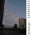 City skyline at dusk with tall apartment buildings and textured cloud sky for urban background and evening skyline banner 143449353