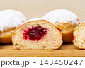 Berliners (German donuts) with raspberry jam 143450247