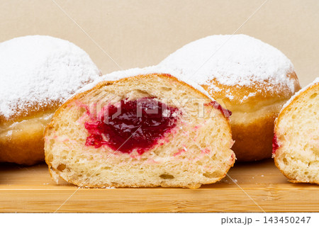Berliners (German donuts) with raspberry jam Berliners (German donuts) with raspberry jam 143450247
