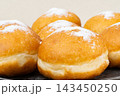 Berliners (German donuts) with raspberry jam 143450250