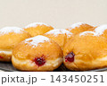 Berliners (German donuts) with raspberry jam 143450251