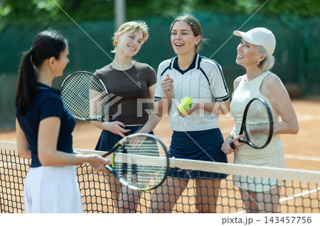 Tennis match female participants chat after game 143457756