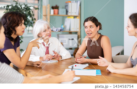 Female participate sit at circle, chatting, talking Female participate sit at circle, chatting, talking 143458754