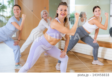 Dance class for people, positive women training in dance studio 143458818