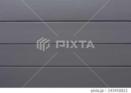 The gray wood panels are laid out horizontally and form a simple surface. Each panel displays a uniform texture and color. The arrangement creates a clean and organized look. 143458821