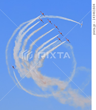 The Canadian Air Force Snowbirds jets team performing acrobatic figures on a blue sky The Canadian Air Force Snowbirds jets team performing acrobatic figures on a blue sky 143461604