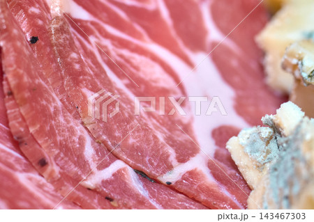 Close-up view of sliced cured meat and gourmet blue cheese on a plate Close-up view of sliced cured meat and gourmet blue cheese on a plate 143467303