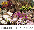 Colorful flower bouquets wrapped in brown kraft paper display 143467988