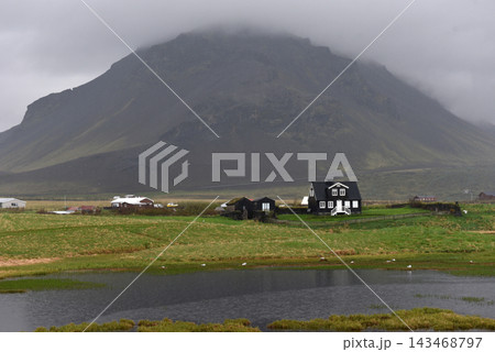 Stapafell mountain reflected in a tranquil lake at Arnarstapi, Iceland 143468797