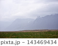 Misty mountain peaks shrouded in thick clouds, Iceland 143469434