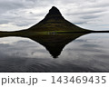 Water ripples breaking the reflection of Kirkjufell mountain, Iceland 143469435