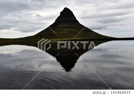 Water ripples breaking the reflection of Kirkjufell mountain, Iceland Water ripples breaking the reflection of Kirkjufell mountain, Iceland 143469435