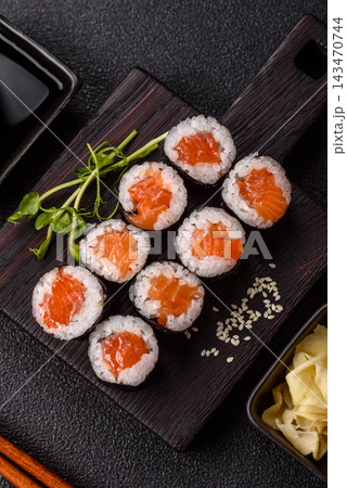 Sushi roll with tuna, rice, and cream cheese, served with soy sauce, wasabi, and ginger. Tuna roll Sushi roll with tuna, rice, and cream cheese, served with soy sauce, wasabi, and ginger. Tuna roll 143470744