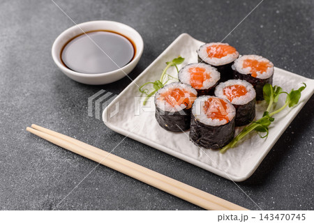 Sushi roll with tuna, rice, and cream cheese, served with soy sauce, wasabi, and ginger. Tuna roll Sushi roll with tuna, rice, and cream cheese, served with soy sauce, wasabi, and ginger. Tuna roll 143470745