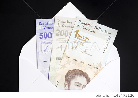 Venezuelan money - Bolivar in a white envelope Venezuelan money - Bolivar in a white envelope 143473126
