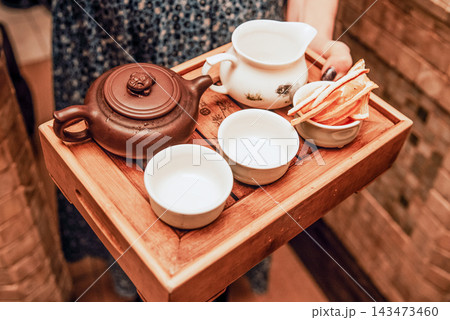 Fragrant healthy tea in glass mug brewed in teapot, cafe of Indian cuisine 143473460