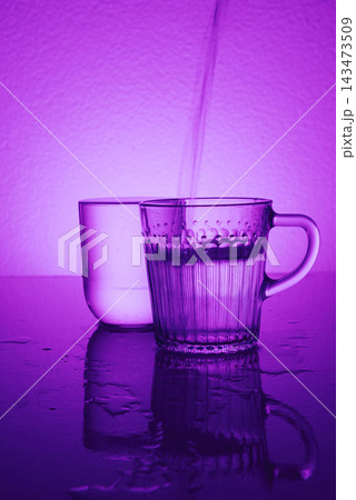 Pure water fluoride free pours into glass, concept wellness detox healthy drinks Pure water fluoride free pours into glass, concept wellness detox healthy drinks 143473509