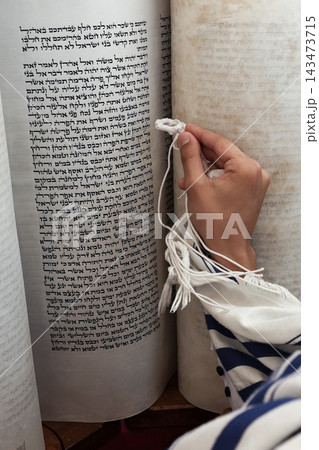 Jewish boy reading from open Torah scroll during Bar Mitzvah ceremony at Western Wall, Jerusalem, Israel 143473715