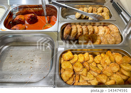 Buffet smorgasbord in hotel restaurant, various food garnish dishes on tray Buffet smorgasbord in hotel restaurant, various food garnish dishes on tray 143474591