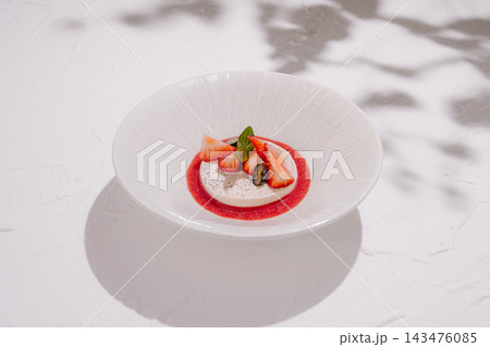 Panna cotta with fresh strawberries and mint Panna cotta with fresh strawberries and mint 143476085
