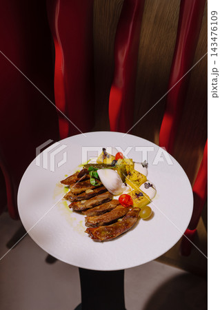 Gourmet pork strips with polenta and poached egg Gourmet pork strips with polenta and poached egg 143476109