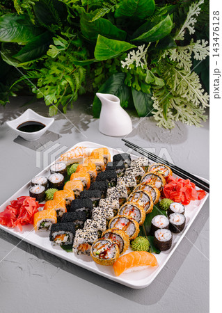 Japanese sushi set with rolls and ginger on plate 143476128