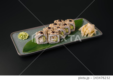 Sushi rolls with eel, avocado, sesame, wasabi, and ginger Sushi rolls with eel, avocado, sesame, wasabi, and ginger 143476232