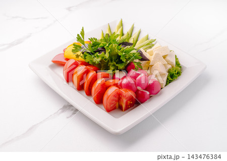 Fresh vegetable platter with cheese cubes and herbs Fresh vegetable platter with cheese cubes and herbs 143476384