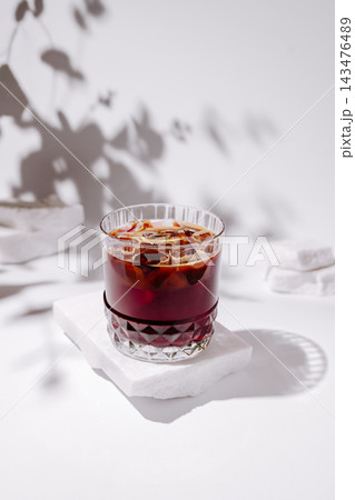 Iced coffee drink on white marble, summer refreshment Iced coffee drink on white marble, summer refreshment 143476489