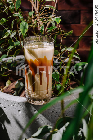 Iced caramel latte drink with dripping sauce Iced caramel latte drink with dripping sauce 143476490