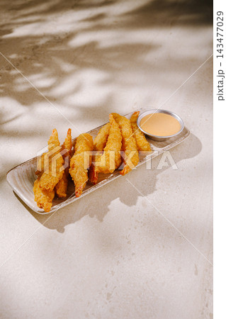 Crispy tempura shrimp with dipping sauce serving as appetizer 143477029
