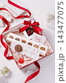 Valentine's day chocolate gift box with red ribbon 143477075