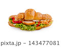 Croissant sandwich with grilled chicken, lettuce, red pepper 143477081
