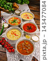 Romanian sour traditional soups with basil, pepper, tomato 143477084
