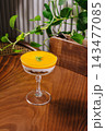 Mango parfait dessert with granola and mint leaf 143477085