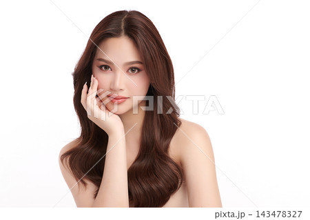 A beautiful young Asian woman with clean, fresh skin against a white background. Skincare, facial treatment, cosmetology, beauty, and spa. An elegant portrait of an Asian woman. A beautiful young Asian woman with clean, fresh skin against a white background. Skincare, facial treatment, cosmetology, beauty, and spa. An elegant portrait of an Asian woman. 143478327
