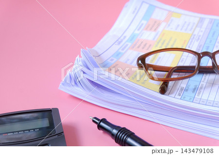 Stack of documents with calculator and pen on background. Stack of documents with calculator and pen on background. 143479108