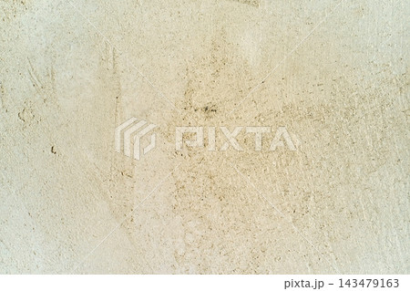 Rough beige concrete wall texture background with subtle stains and weathered surface for construction design, architecture presentations, and website banners and website headers Rough beige concrete wall texture background with subtle stains and weathered surface for construction design, architecture presentations, and website banners and website headers 143479163