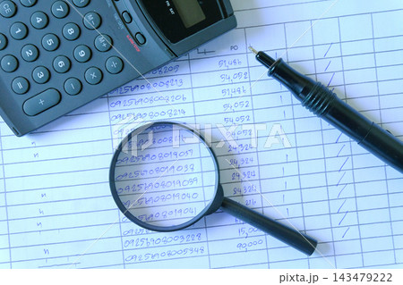Magnifying glass and pen on Stack of documents. Magnifying glass and pen on Stack of documents. 143479222