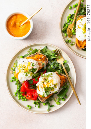 This meal features gluten free bread sandwiches topped with zucchini caviar and poached egg. It includes roasted red peppers and green peas, served with baked pears This meal features gluten free bread sandwiches topped with zucchini caviar and poached egg. It includes roasted red peppers and green peas, served with baked pears 143479275