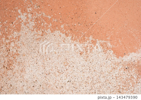 Weathered Terracotta Plaster Wall With Peeling Paint and Rough Texture Weathered Terracotta Plaster Wall With Peeling Paint and Rough Texture 143479390