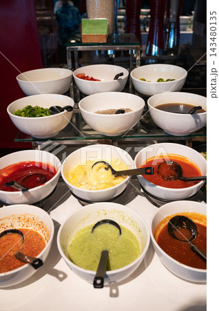 Colorful Sauce and Condiment Buffet Display 143480135