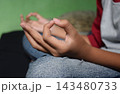 Close up of woman hands in gyan mudra pose. Concept of mindfulness, mental health relaxation, and inner peace. 143480733