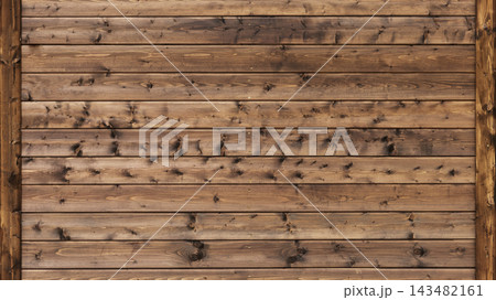 Rustic wooden wall featuring horizontal planks, visible knots 143482161