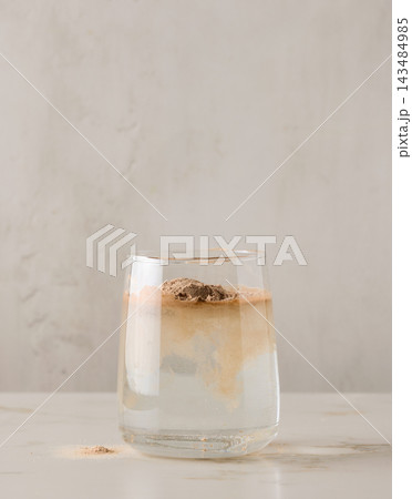 protein powder is poured into glass with water protein powder is poured into glass with water 143484985