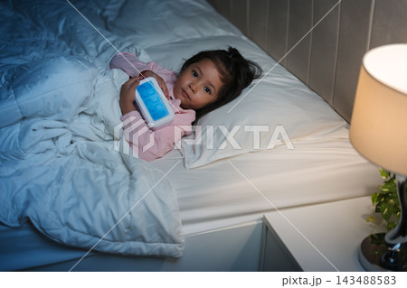 tired preschool child girl having trouble sleeping in bed late at night, insomnia concept tired preschool child girl having trouble sleeping in bed late at night, insomnia concept 143488583